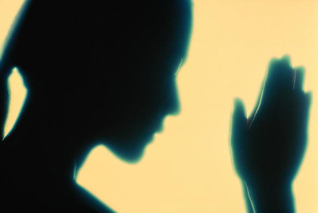 praying woman.jpg (24952 bytes)